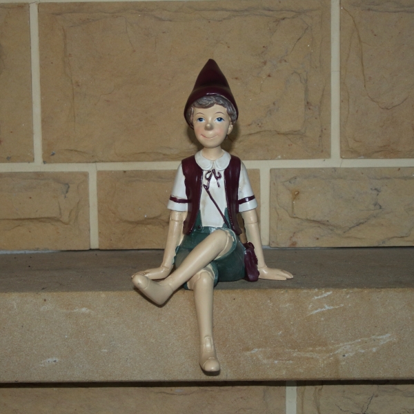 Vánoční dekorácie Pinocchio na lavičke 13x24x10cm